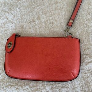 Pretty Orange leather like clutch/shoulder bag. Never used- brand new.